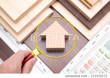 Close-up of a house (building materials, metal finger, calculator) Close-up of a house (building materials, metal finger, calculator) 131019172