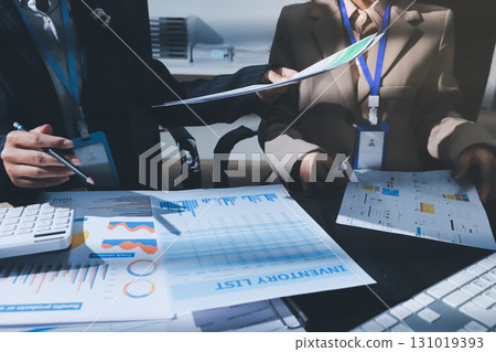 Close up high angle Asian businesswoman working with her coworker in meeting room Close up high angle Asian businesswoman working with her coworker in meeting room 131019393