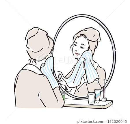 一位身穿浴袍的女士站在鏡子前洗臉 131020045