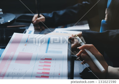Close up high angle Asian businesswoman working with her coworker in meeting room 131021590