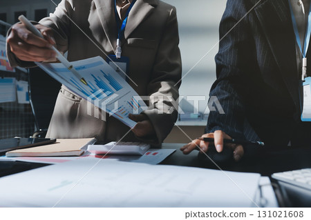 Close up high angle Asian businesswoman working with her coworker in meeting room 131021608