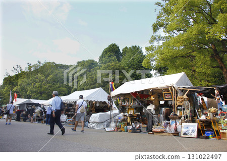 Stroll through the flea market. Pick up anything you like. Stroll through the flea market. Pick up anything you like. 131022497