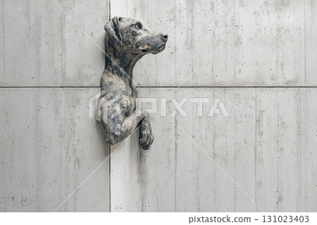A relief of a dog jumping out of a concrete wall 131023403