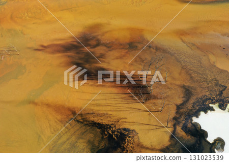 Aerial view of acid mine water drainage flow, toxic mine waters polluting the environment 131023539