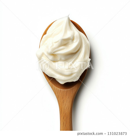 Top view of Fresh mayonnaise yogurt or sour cream caramel on wooden spoon isolated on white background 131023873