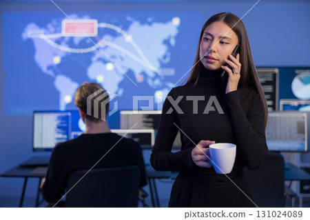 Female Incident Responder Analyzing Data in Cybersecurity Operations Center Female Incident Responder Analyzing Data in Cybersecurity Operations Center 131024089