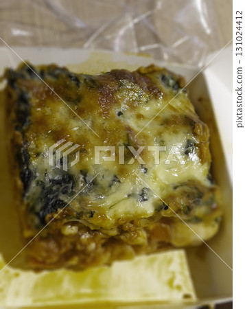 Vegan lasagna with tofu tomato sauce and spinach 131024412