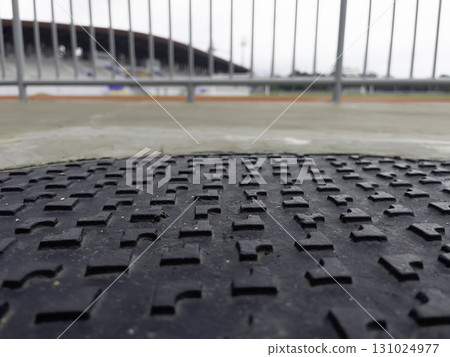 Football field and the treadmill in the sports stadium after rain blur background concept Football field and the treadmill in the sports stadium after rain blur background concept 131024977