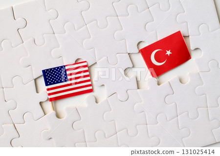 United States and Turkey flags on puzzle pieces, symbol of partnership, cooperation, and international relations 131025414