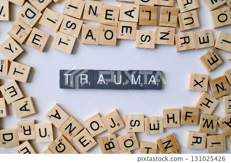 Trauma word in wooden cube blocks, psychological stress concept, emotional injury and mental health idea, recovery and therapy theme Trauma word in wooden cube blocks, psychological stress concept, emotional injury and mental health idea, recovery and therapy theme 131025426