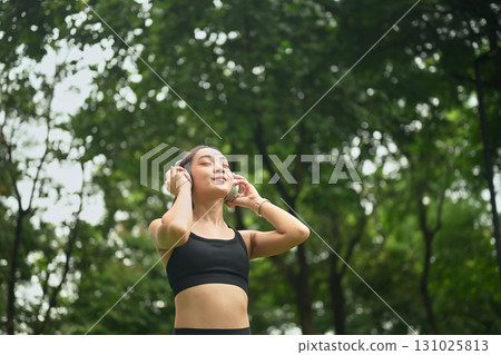 Serene asian runner woman enjoy fresh air with gratitude Serene asian runner woman enjoy fresh air with gratitude 131025813