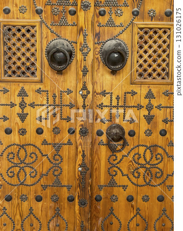 Intricate wooden door from Djerba, Tunisia showcasing traditional Arabic design elements and unique 131026175