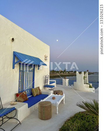 Relaxing day at a beautiful beach in Djerba, Tunisia with turquoise waters and sunny skies Relaxing day at a beautiful beach in Djerba, Tunisia with turquoise waters and sunny skies 131026215