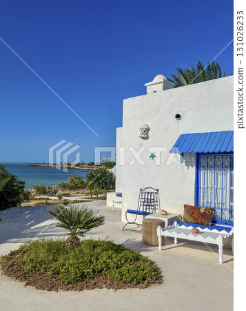 Relaxing day at a beautiful beach in Djerba, Tunisia with turquoise waters and sunny skies 131026233