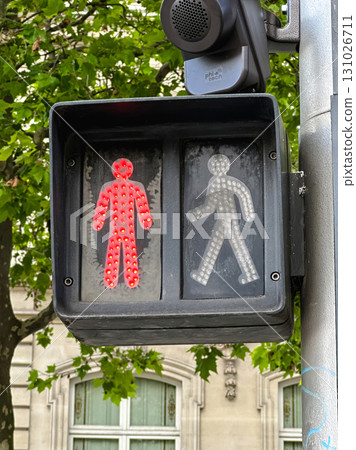 A close-up shot of a traffic light for pedestrians, with the red don't walk signal illuminated. A close-up shot of a traffic light for pedestrians, with the red don't walk signal illuminated. 131026711