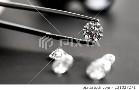 Diamond in jewelry tweezers 131027271