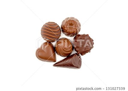 A close up of a chocolate dessert with a heart shaped piece A close up of a chocolate dessert with a heart shaped piece 131027339