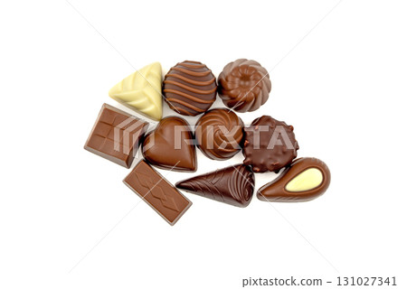 A bunch of chocolate candies are laid out on a white background A bunch of chocolate candies are laid out on a white background 131027341