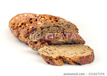 A slice of bread with nuts on it 131027374