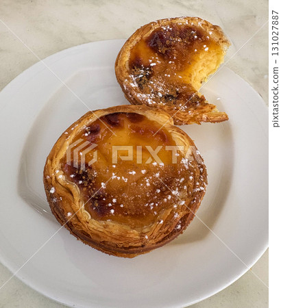 Two Delicious Portuguese Egg Tart Pastry With a Creamy Filling Two Delicious Portuguese Egg Tart Pastry With a Creamy Filling 131027887