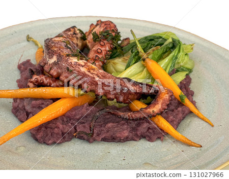 Grilled Octopus With Root Vegetables and Greens on a Plate Grilled Octopus With Root Vegetables and Greens on a Plate 131027966
