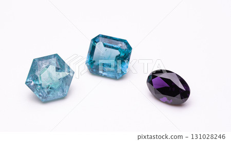 Three different colored gems are shown on a white background Three different colored gems are shown on a white background 131028246
