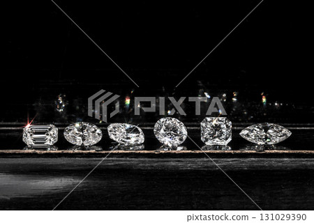 A row of diamonds are displayed on a table A row of diamonds are displayed on a table 131029390