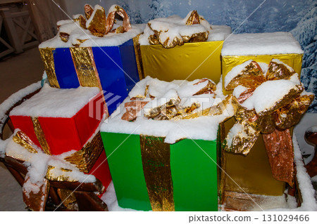 Big Christmas gift boxes covered with white snow 131029466