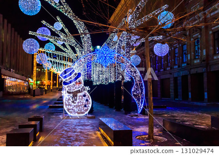 Christmas lights on a city streets. Christmas urban decorations Christmas lights on a city streets. Christmas urban decorations 131029474