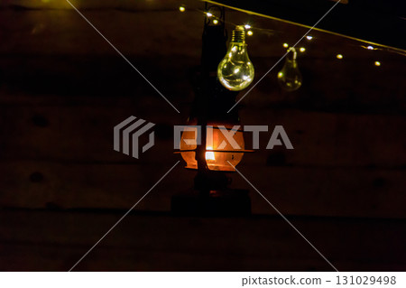 Vintage gas lamp with burning light in the night Vintage gas lamp with burning light in the night 131029498