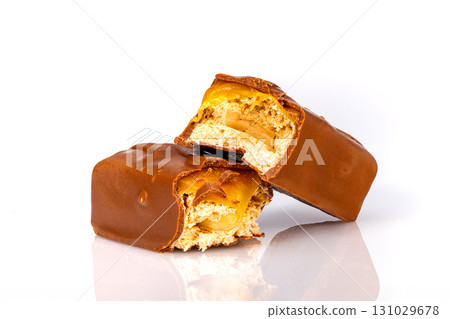 Broken chocolate bar on white background 131029678