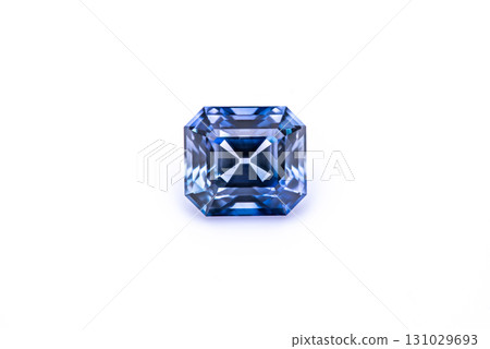 A blue gemstone is sitting on a white background A blue gemstone is sitting on a white background 131029693