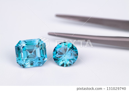 Two blue gems are on a white background Two blue gems are on a white background 131029740