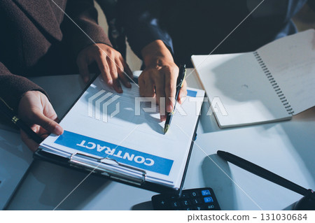 Lawyer explained to the client about the law that must be brought against the court case. Lawyer explained to the client about the law that must be brought against the court case. 131030684