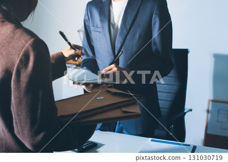 Lawyer explained to the client about the law that must be brought against the court case. Lawyer explained to the client about the law that must be brought against the court case. 131030719