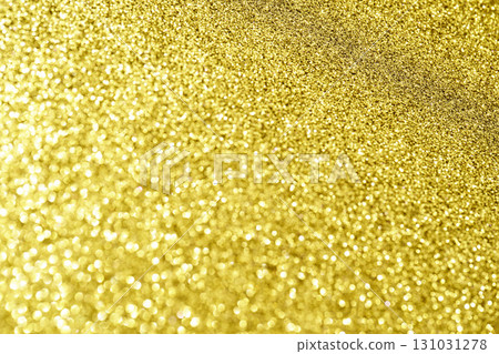 Close up of shimmering gold glitter texture with sparkling bokeh effects 131031278