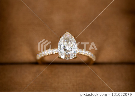 A gold and white diamond ring with a diamond in the center A gold and white diamond ring with a diamond in the center 131032079