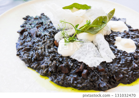 Delicious European squid ink risotto Delicious European squid ink risotto 131032470