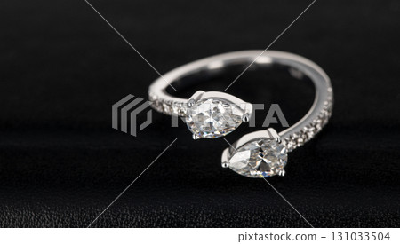 A ring with two diamonds and a band 131033504