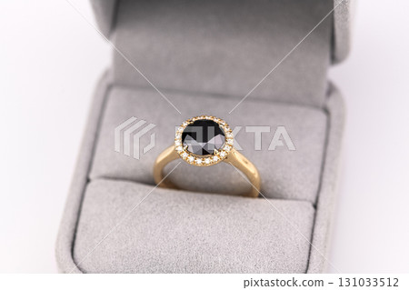 A gold and black ring with diamonds A gold and black ring with diamonds 131033512