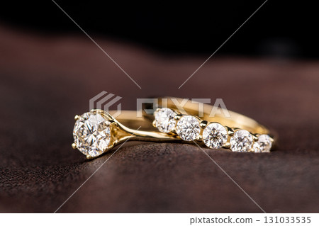 A gold and diamond ring with a diamond band and a diamond band 131033535