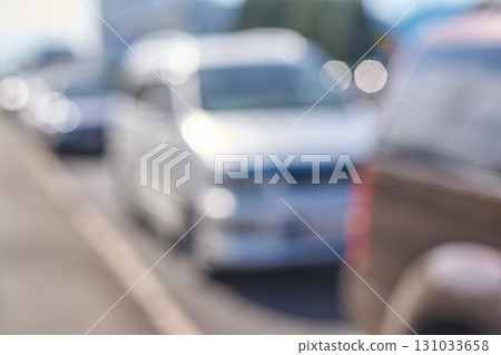 Blurred urban traffic scene with multiple cars on sunny day Blurred urban traffic scene with multiple cars on sunny day 131033658