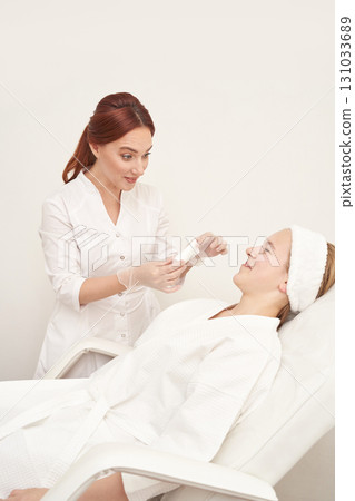 Caucasian female beauty treatment session with skincare expert in spa setting 131033689