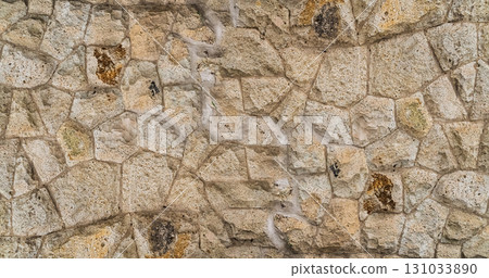 stone wall of uneven stones close-up, wall of an old house 131033890