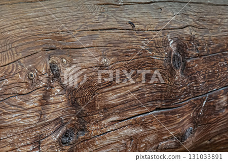 wooden background natural pine beam with cracks closeup wooden background natural pine beam with cracks closeup 131033891
