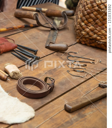 leather carving tools, vintage tools on the table leather carving tools, vintage tools on the table 131033892