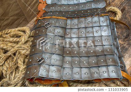 traditional warrior protection iron plates on a leather base close-up traditional warrior protection iron plates on a leather base close-up 131033905