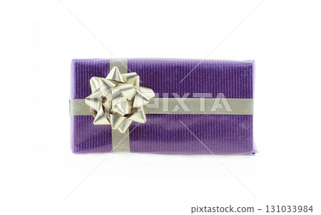purple gift box with gold ribbon and bow on isolated background 131033984