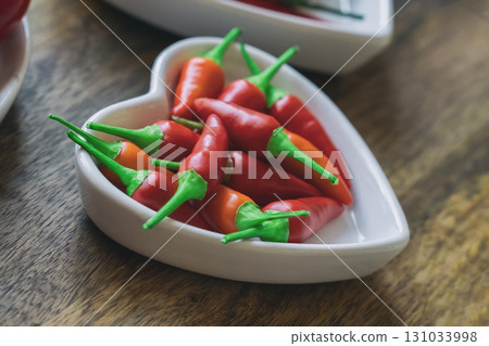 heart shaped plate wa fresh chili pepper hot close up heart shaped plate wa fresh chili pepper hot close up 131033998