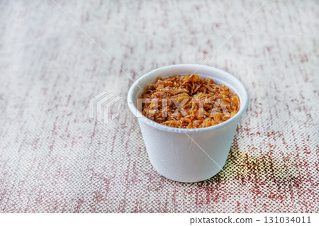 fried crunchy onion in white glass closeup with copy space fried crunchy onion in white glass closeup with copy space 131034011